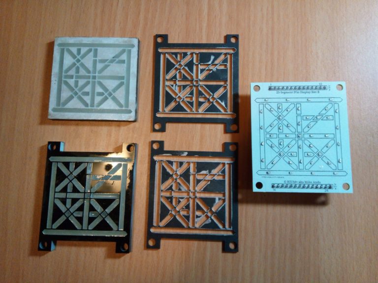 The 5 layers in the 25-segment digital D'ni display modules - acrylic layers on the left, cardboard gaskets in the middle, circuit board on the right